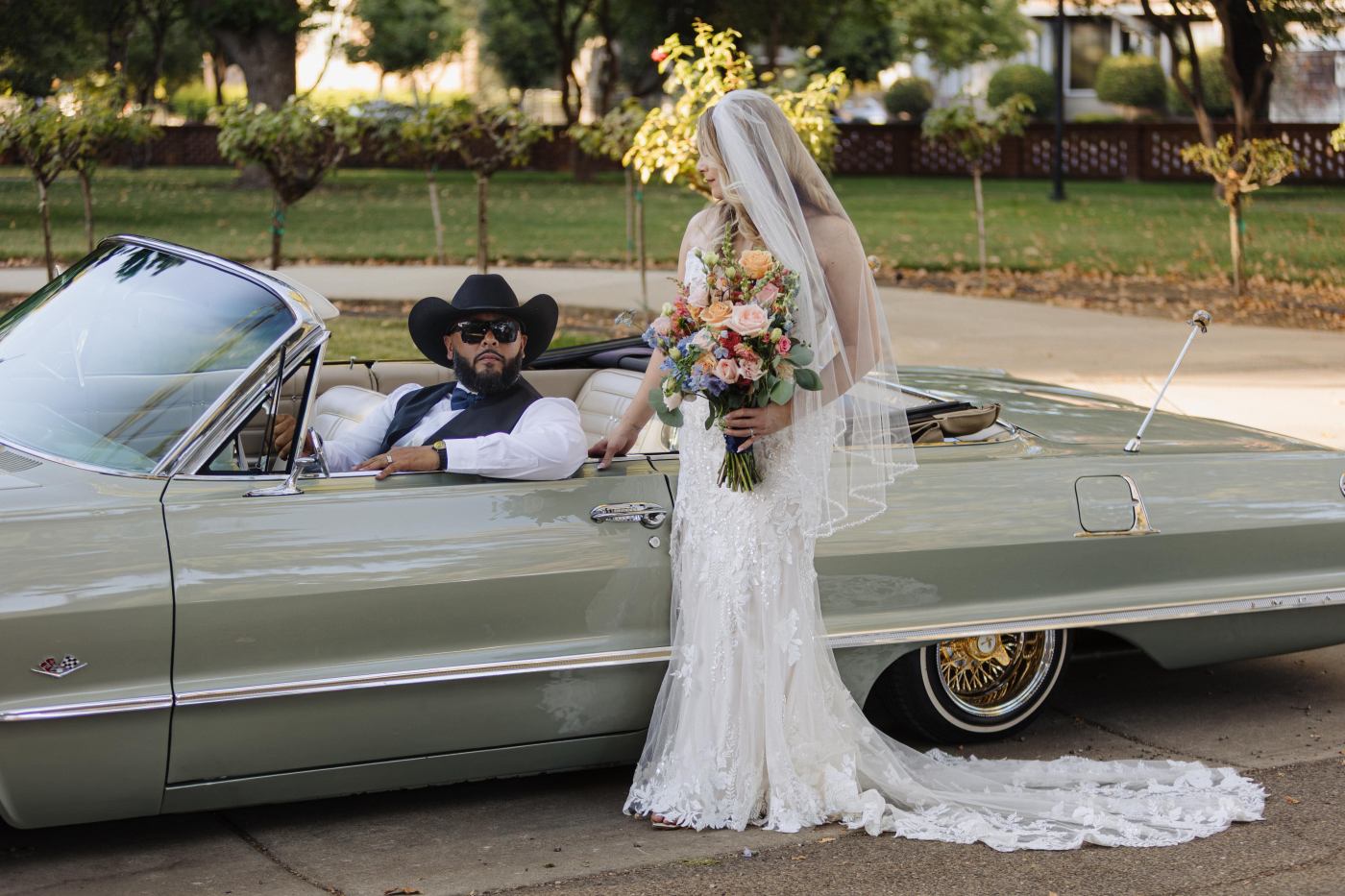 Wedding couple with a classic car
