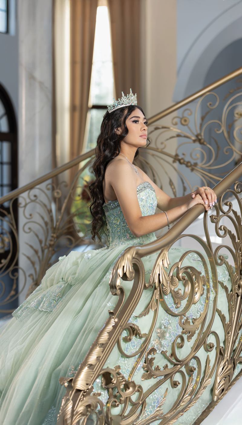 Quinceañera portrait on an ornate staircase